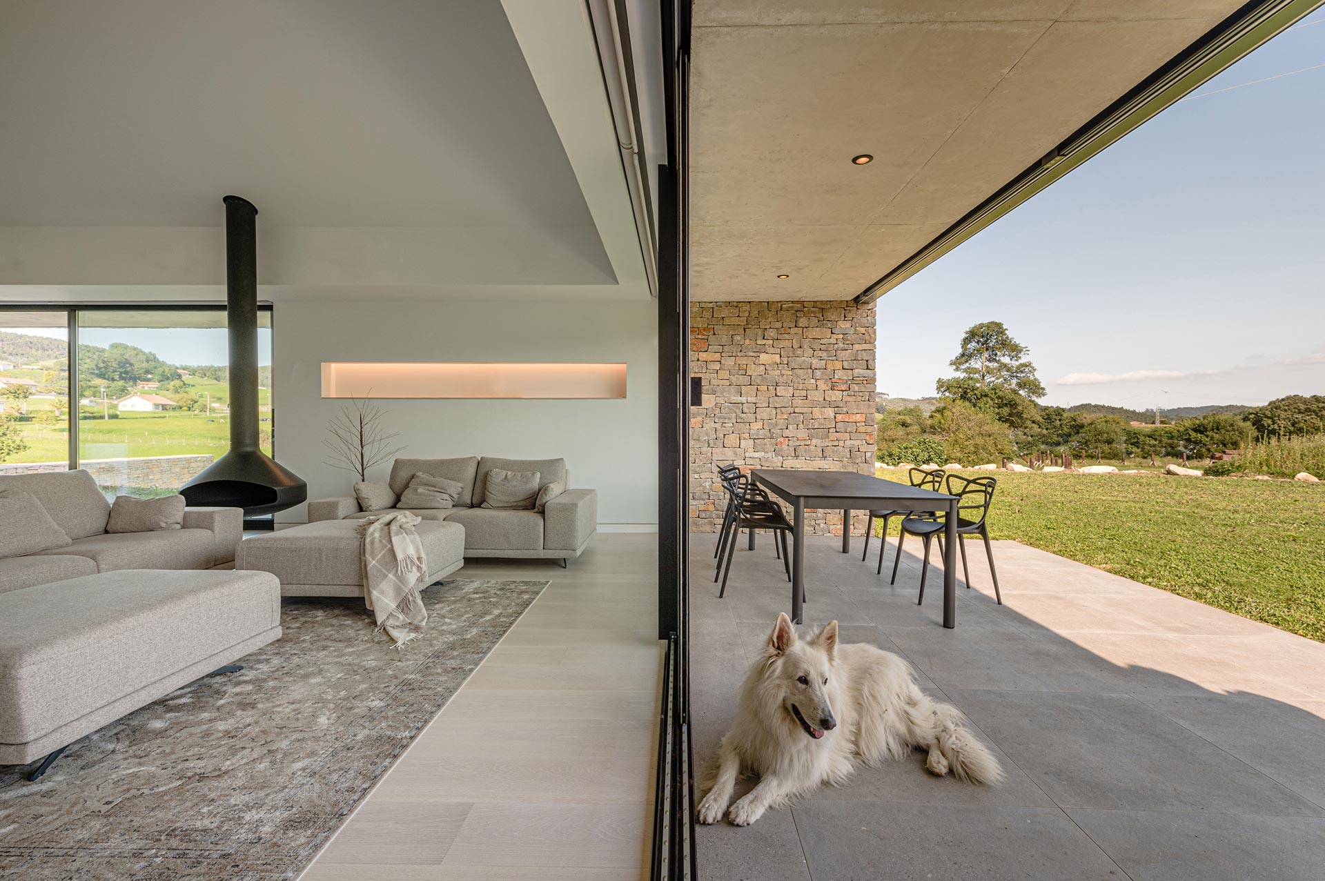 Terrace of stone modern house designed by Moah Architects in Cantabria