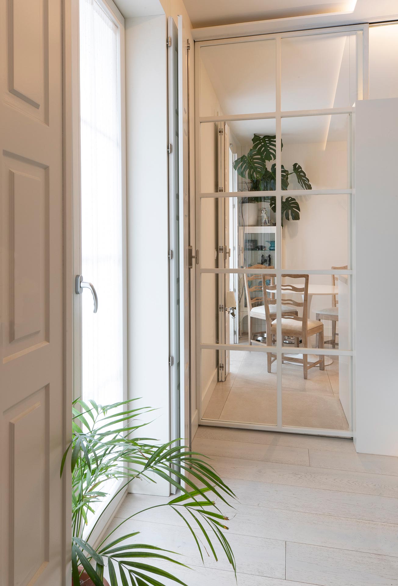 Glass door in modern refurbishment of apartment designed by Moah Arquitectos in Santander